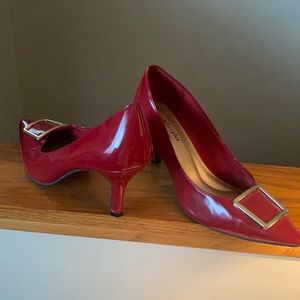 Red heels with gold buckle. Only damage is on toe and heel.
